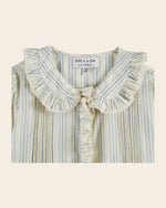 Striped blouse with ruffled collar and bow on an off white background, brand 'Emile & Ida' visible.